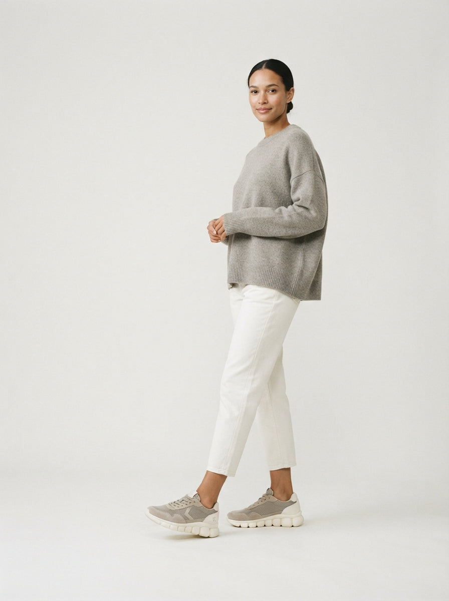 Woman wearing Aloften comfort sneakers in the studio